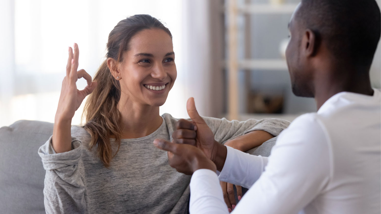 Woman and man doing sign language