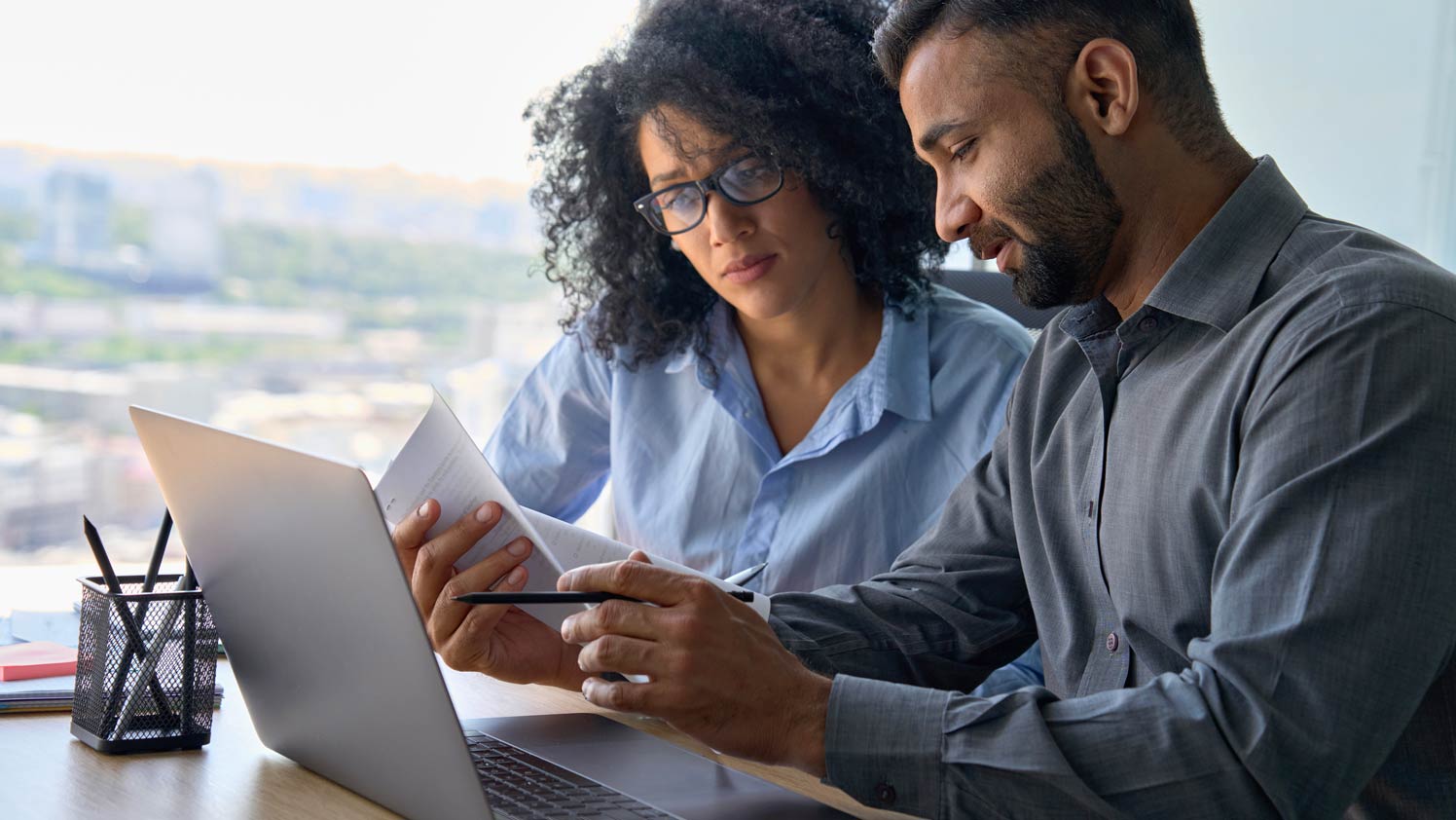 Man and woman looking at a paper