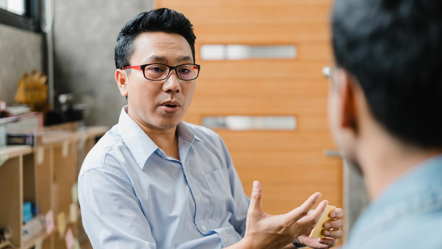 Man explaining something to another man