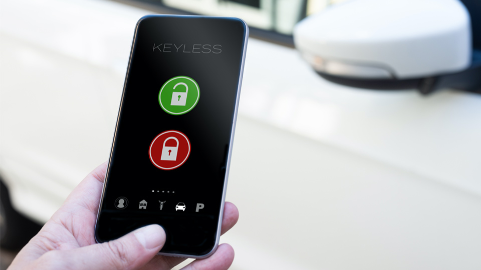 Hand holding a smartphone activating a keyless motorpooling solution