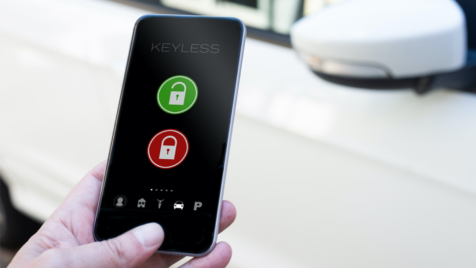A person unlocking a vehicle with a cell phone