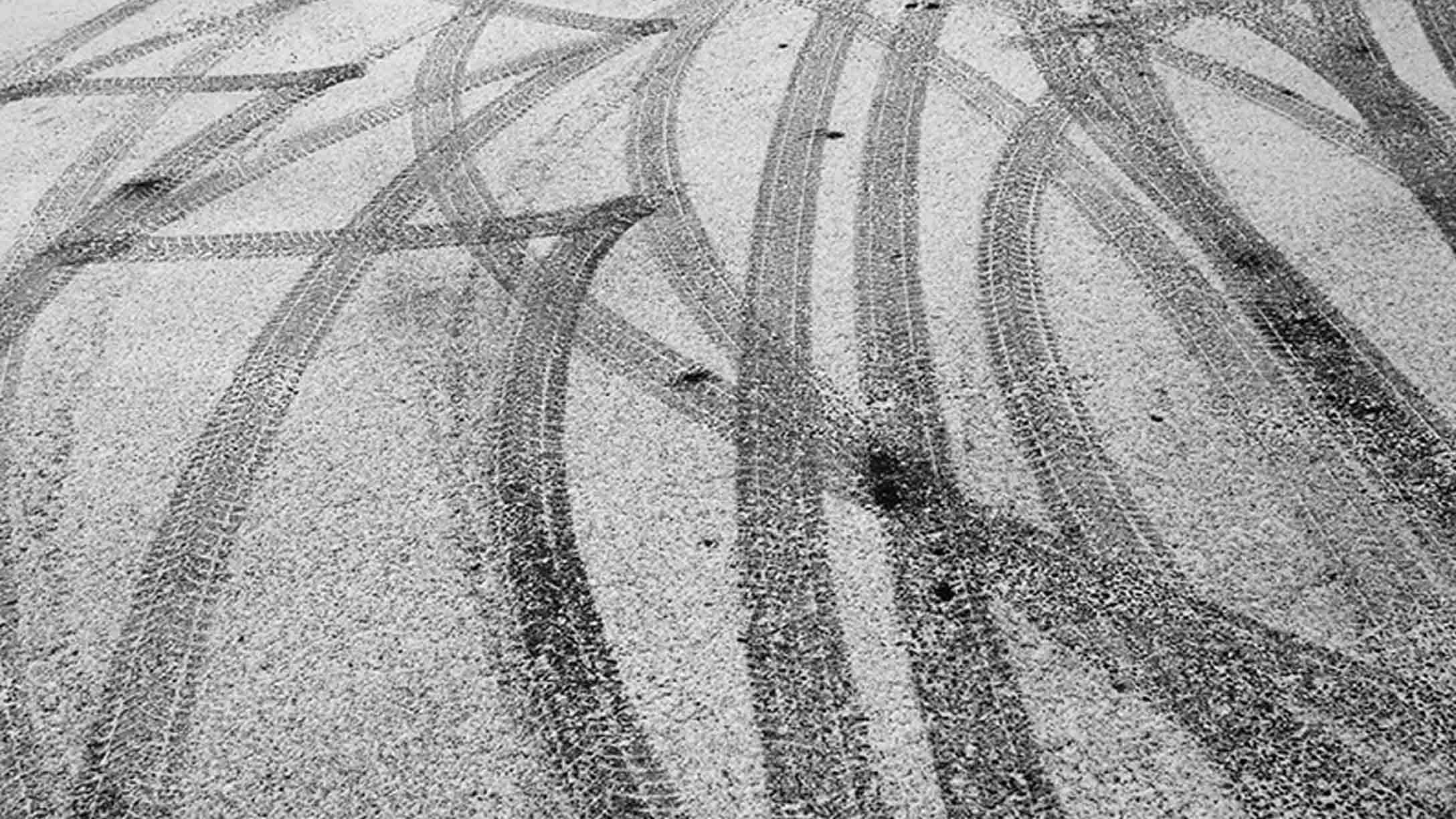 Tire tracks on road in snow