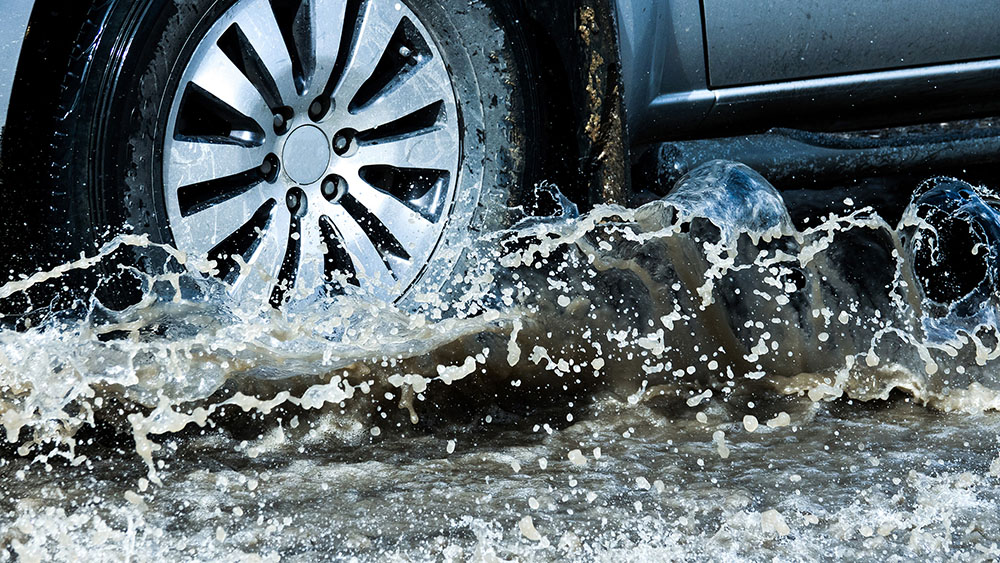 Wheels of truck splashing water