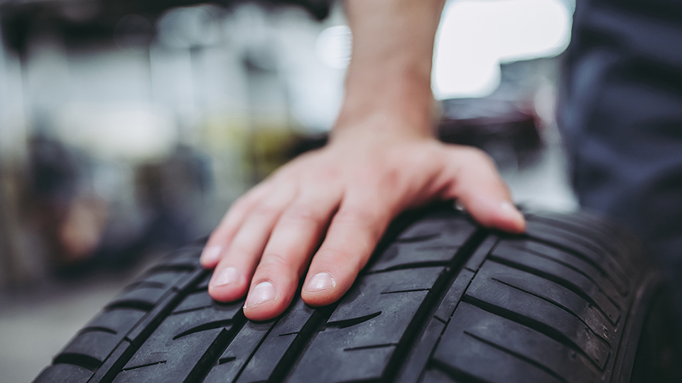 A hand on the tire