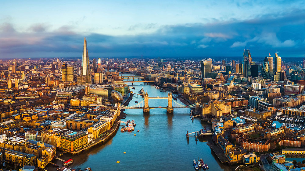 A city with a blue sky and a blue river
