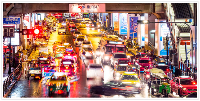 A busy road full of traffic in Asia with a long exposure effect on the photo