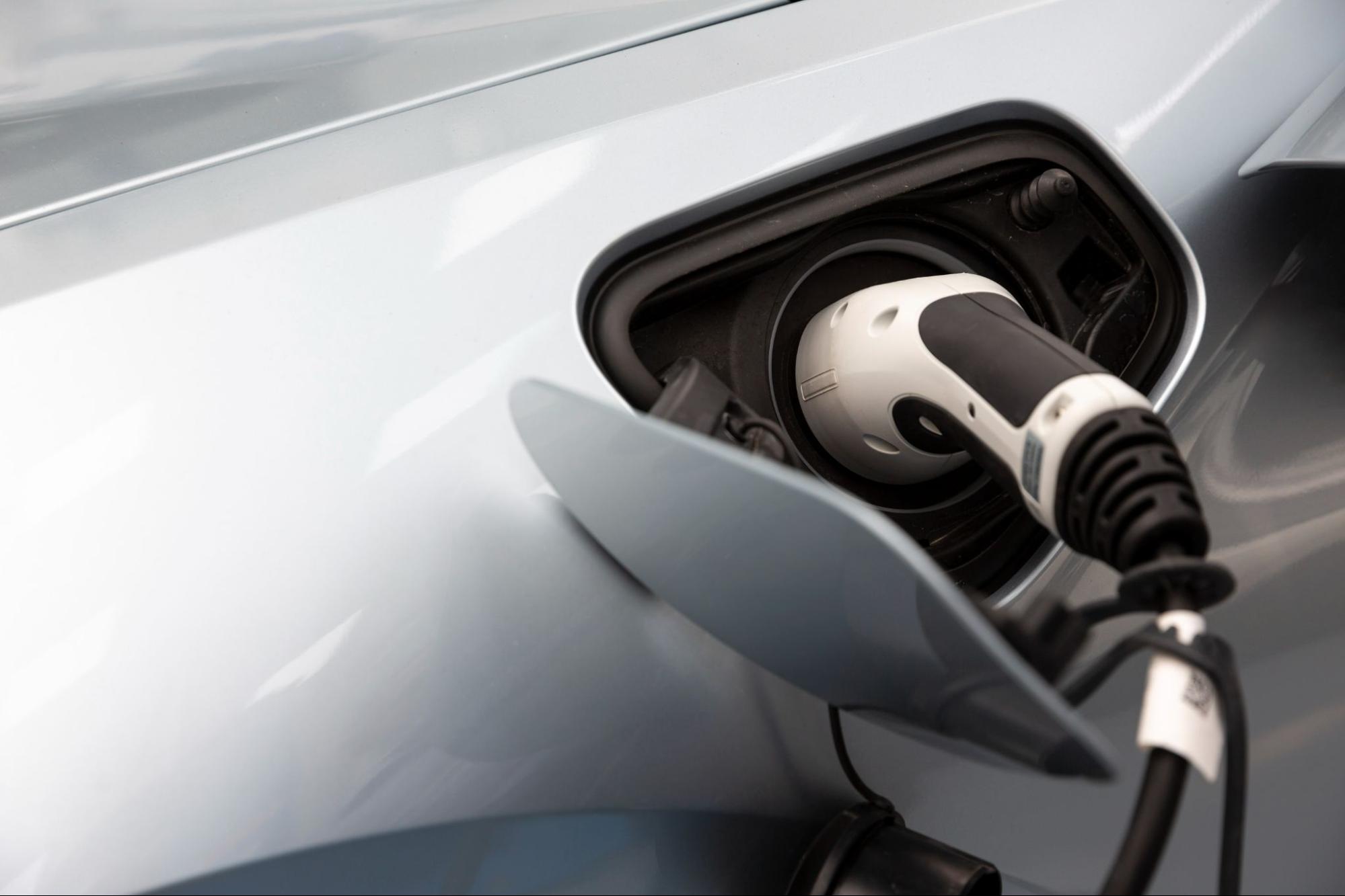 Charger plugged into electric vehicle