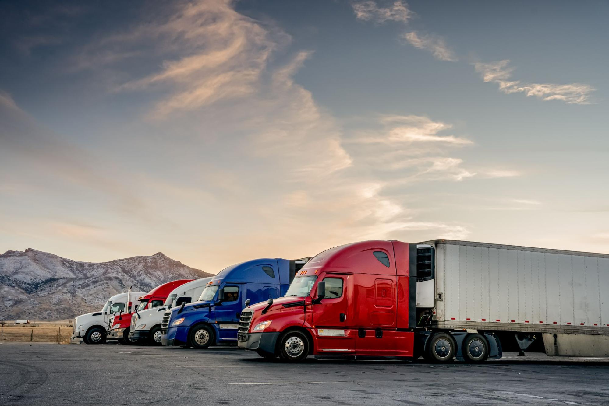 5 trucks parked in a line