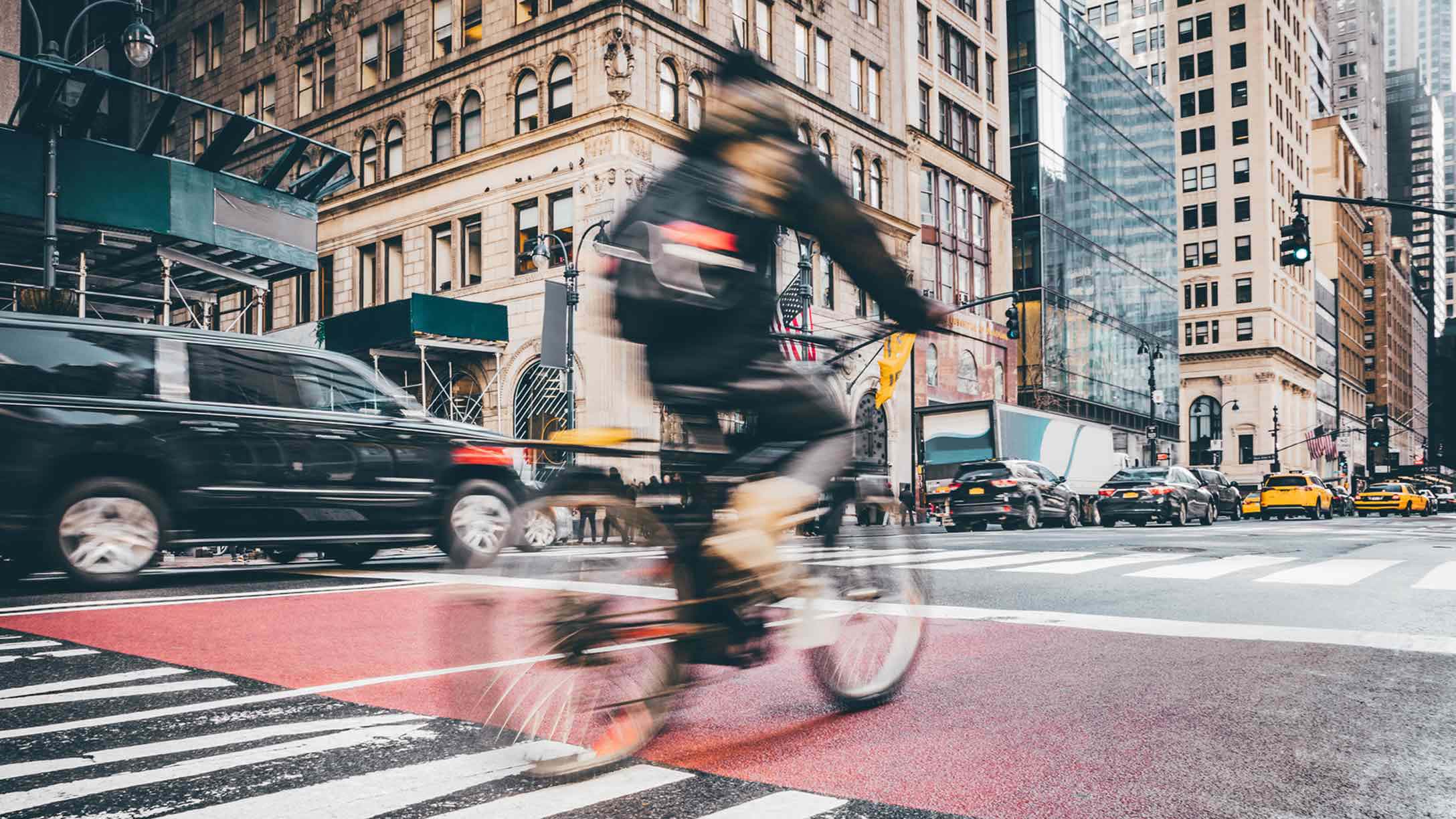 Person biking on busy street