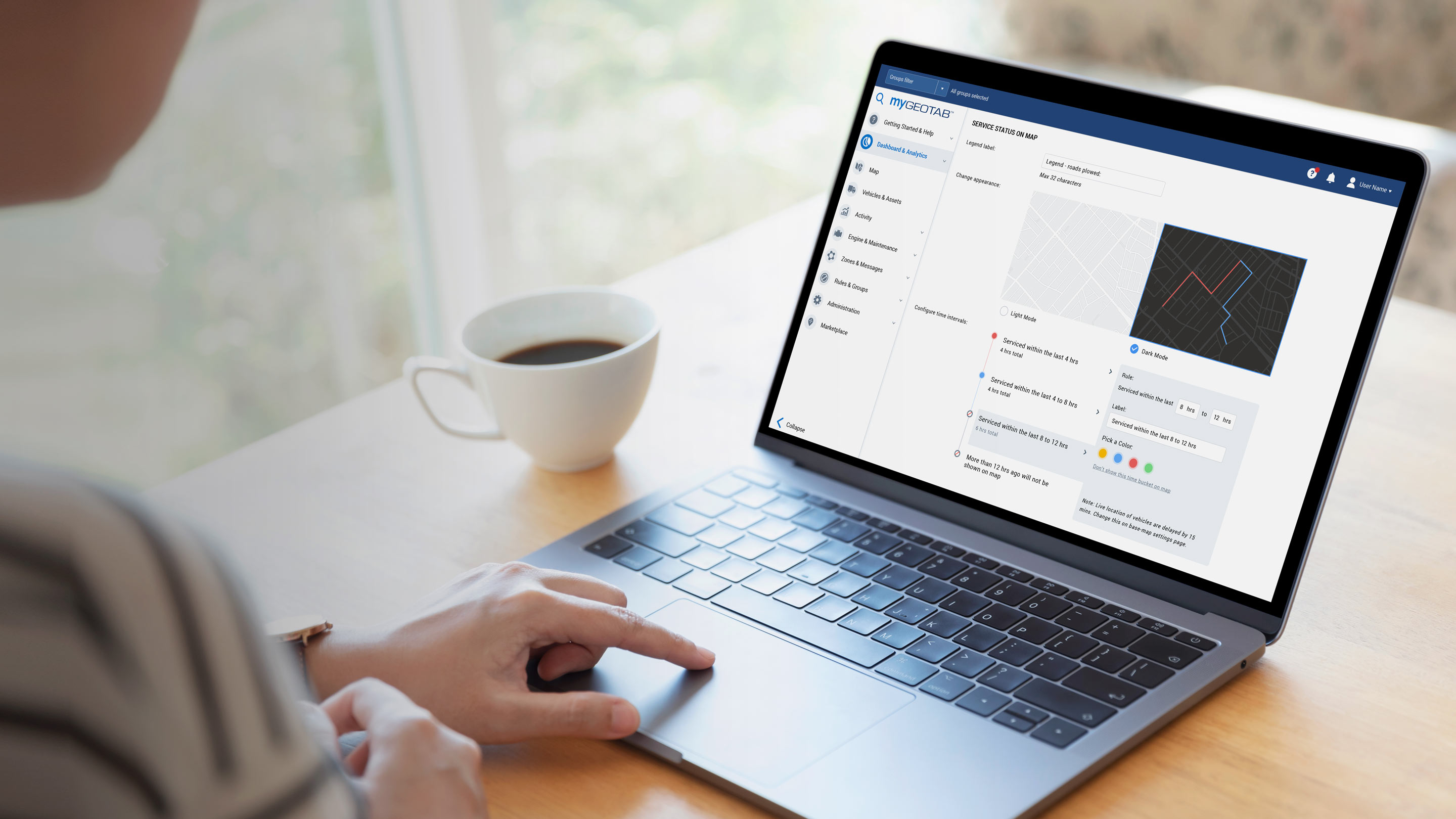 Person using laptop to collect insights on vehicles