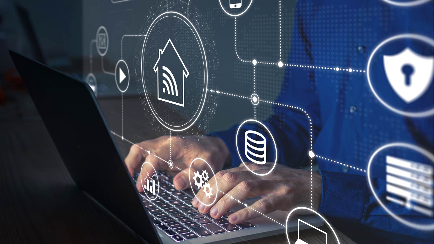 A person using a laptop with configuration icons coming out of the screen