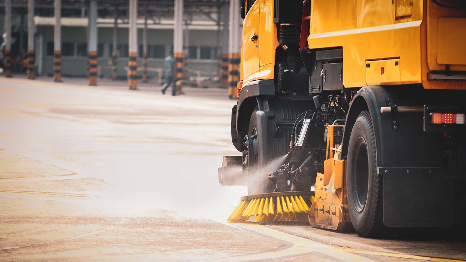 Yellow street sweeper