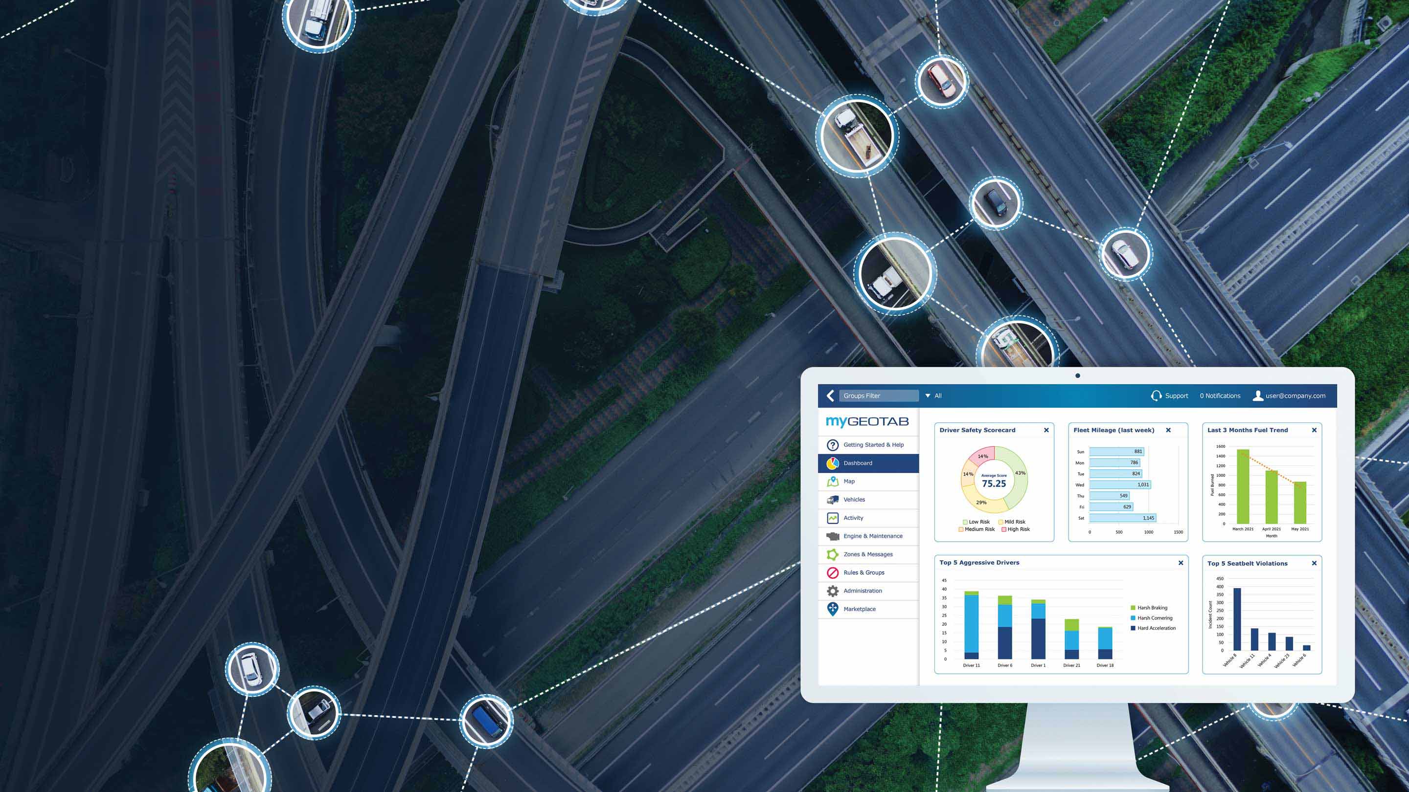 Picture of MyGeotab dashboard with a road of vehicles connected to MyGeotab in the background