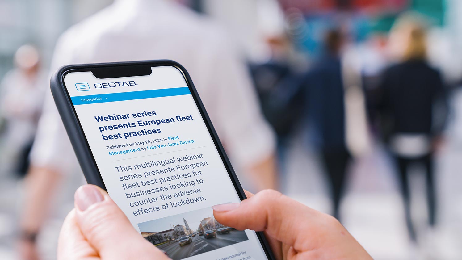 A person visiting the Geotab blog on their phone