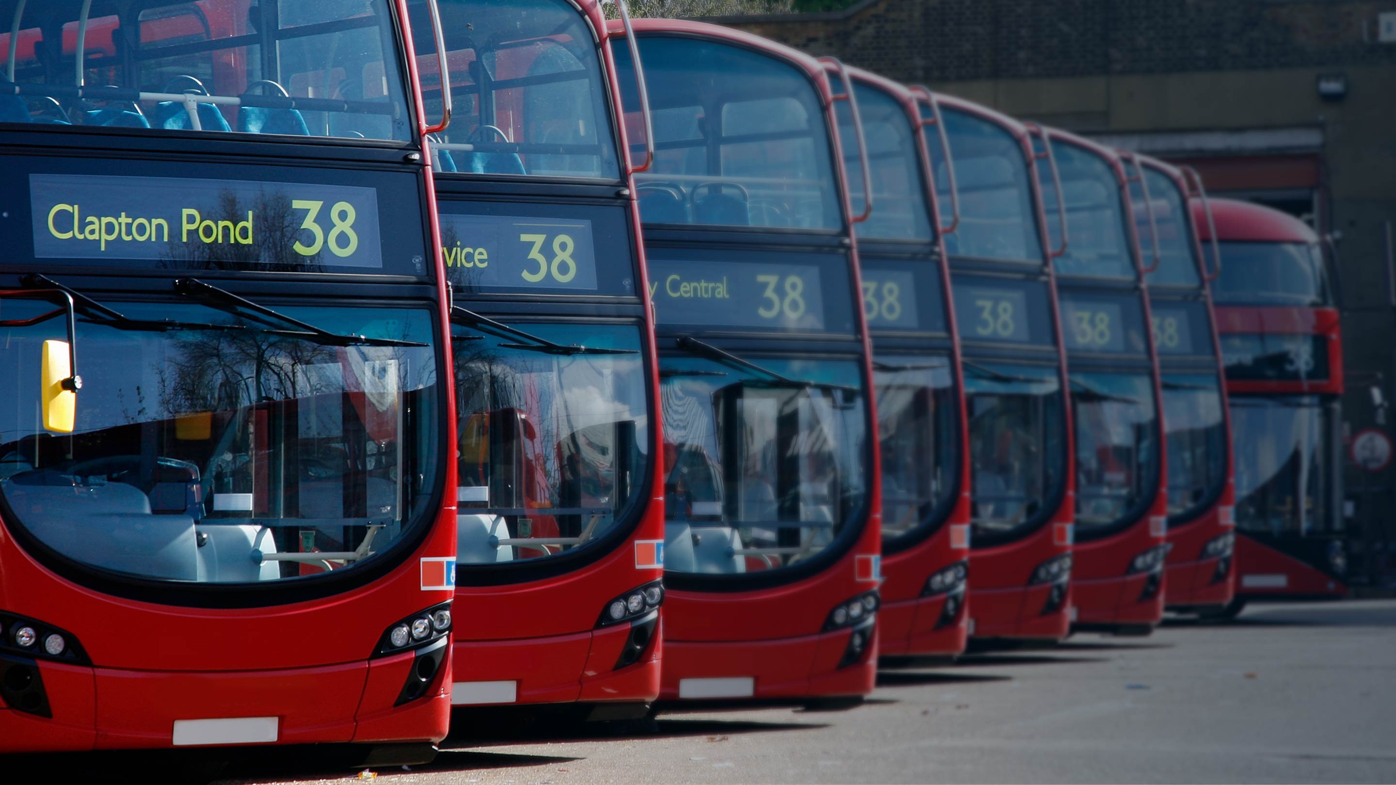 Row of London busses parked diagonally