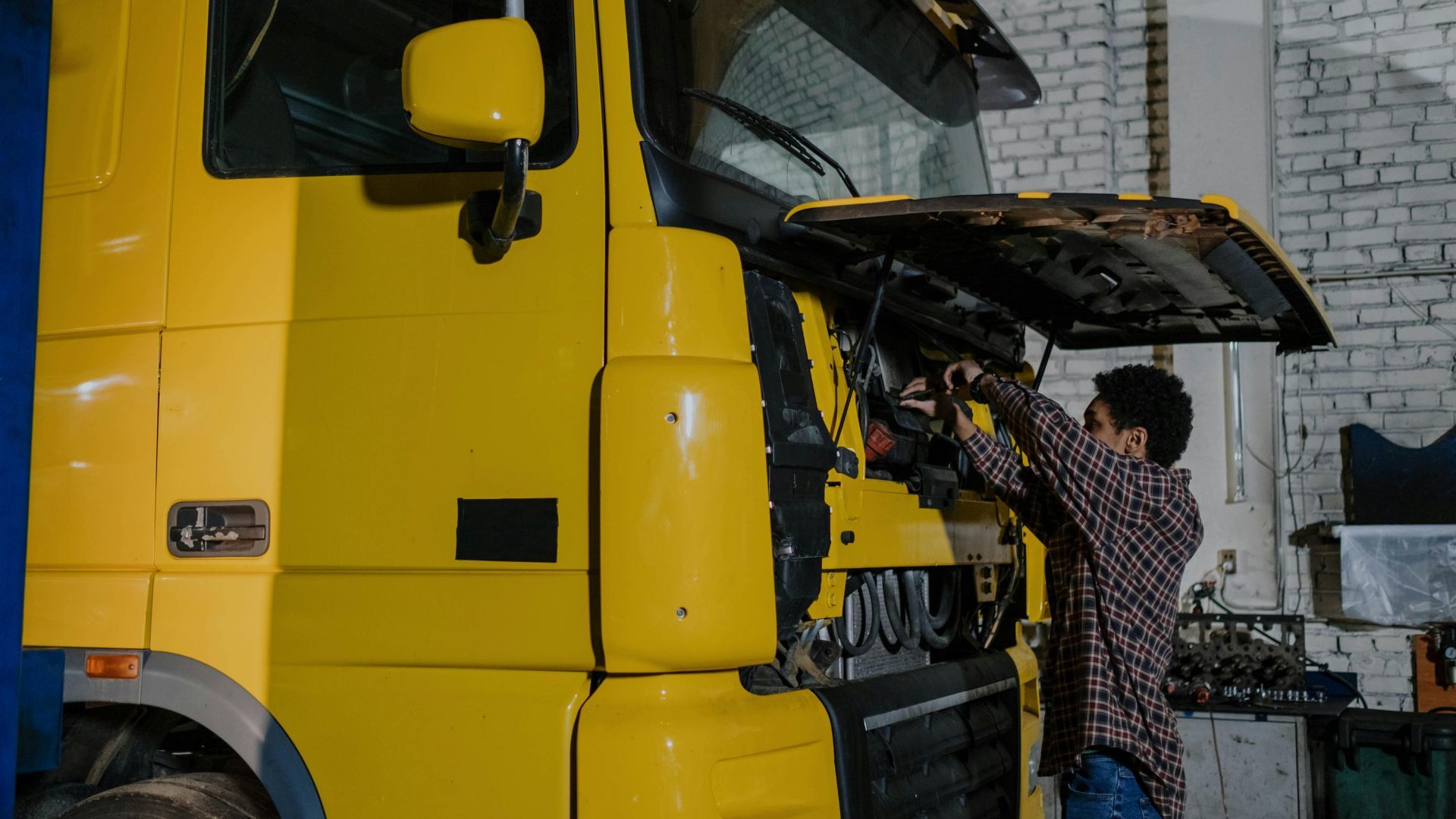 yellow truck and man