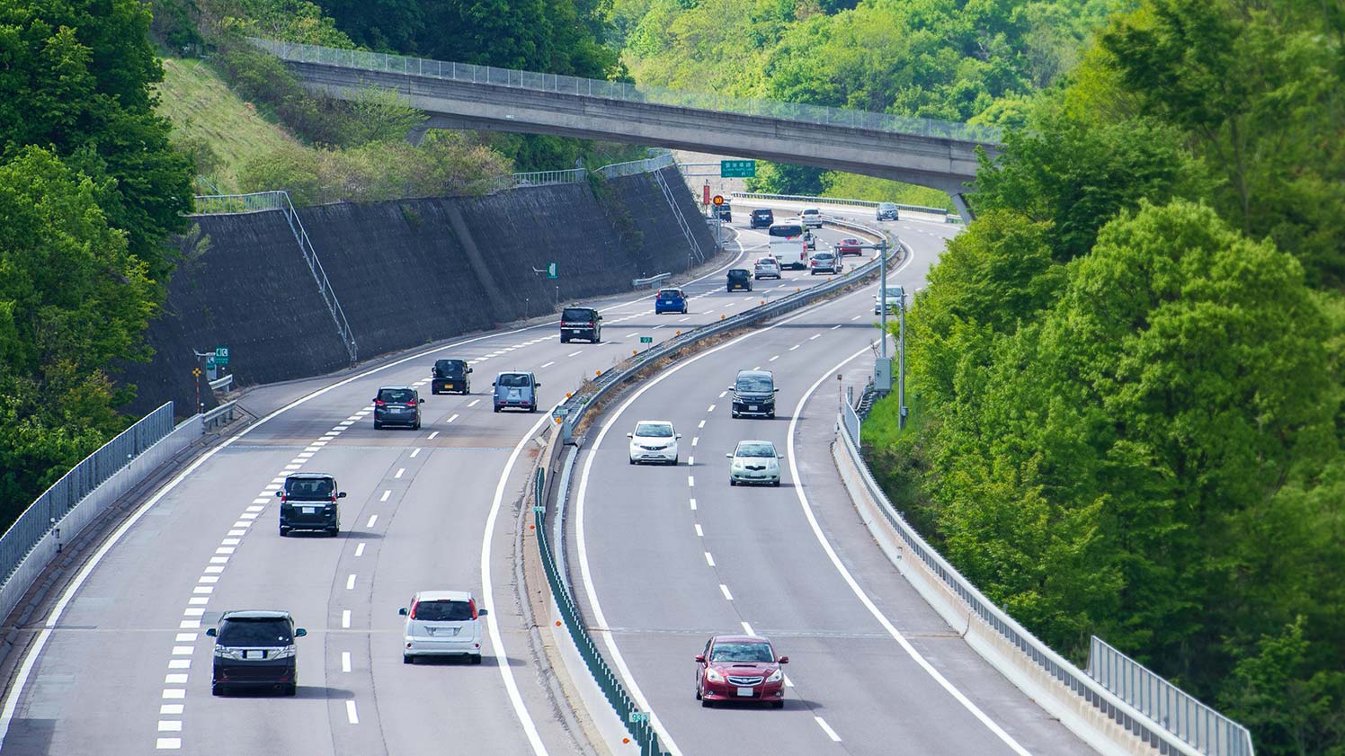 cars being driven on the highway