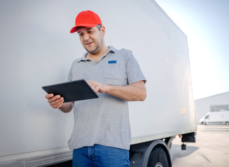 man next to truck