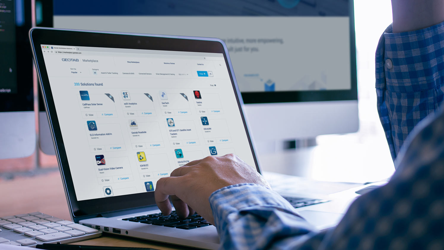 Person using Geotab marketplace on laptop