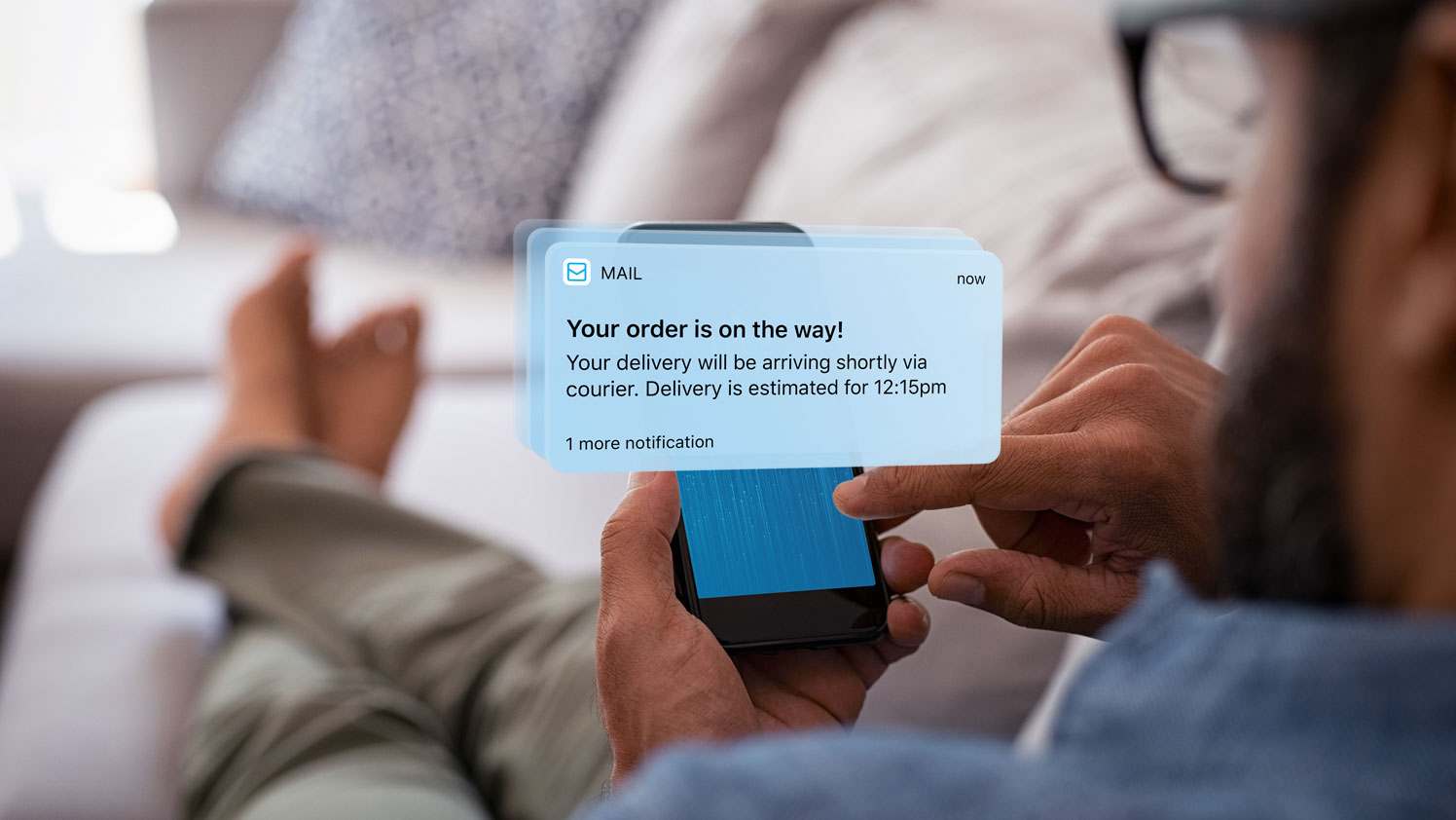 Man looking at a delivery notification on a cellphone