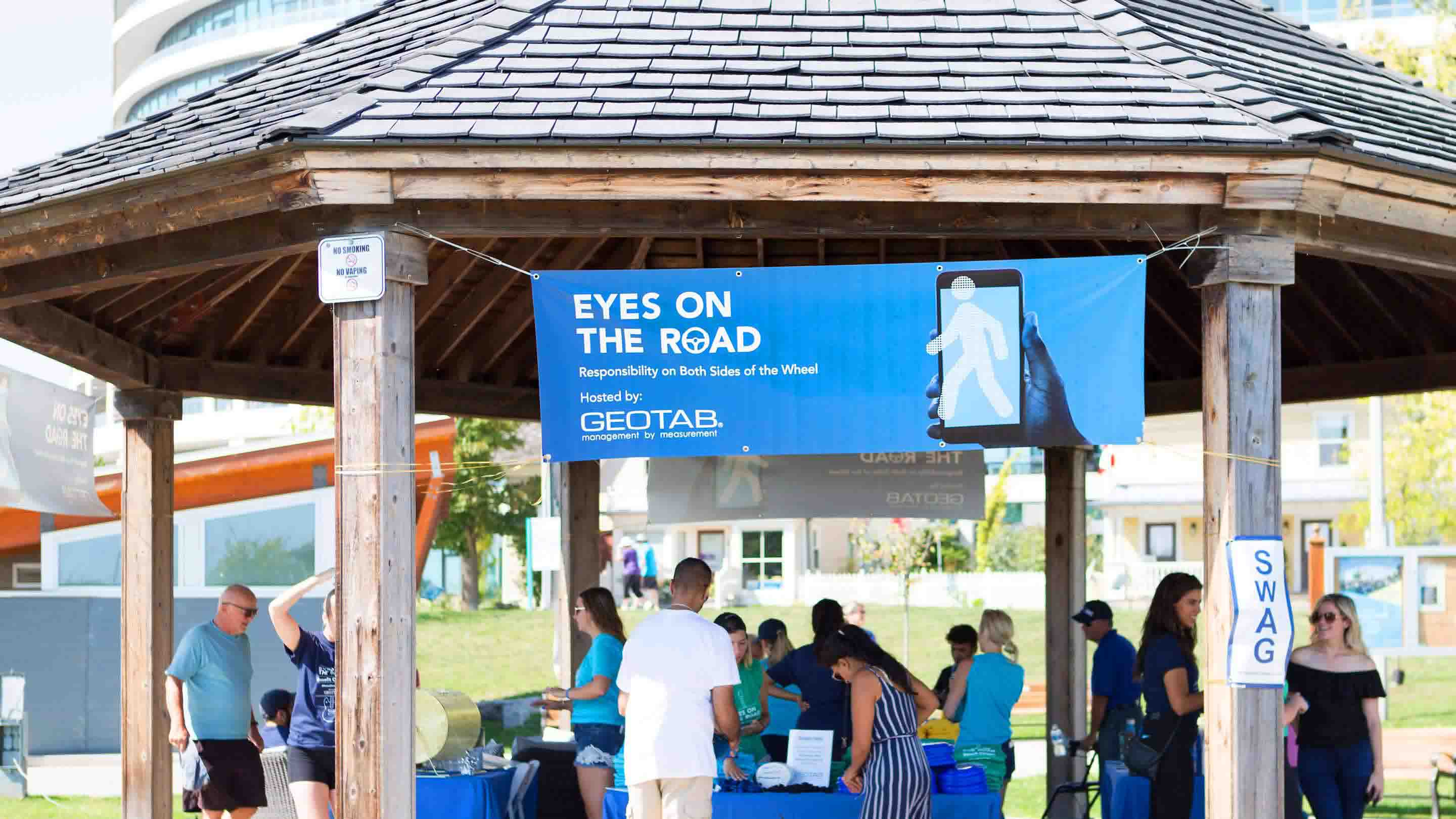 Eyes On The Road event hosted by Geotab outside under a gazebo. 