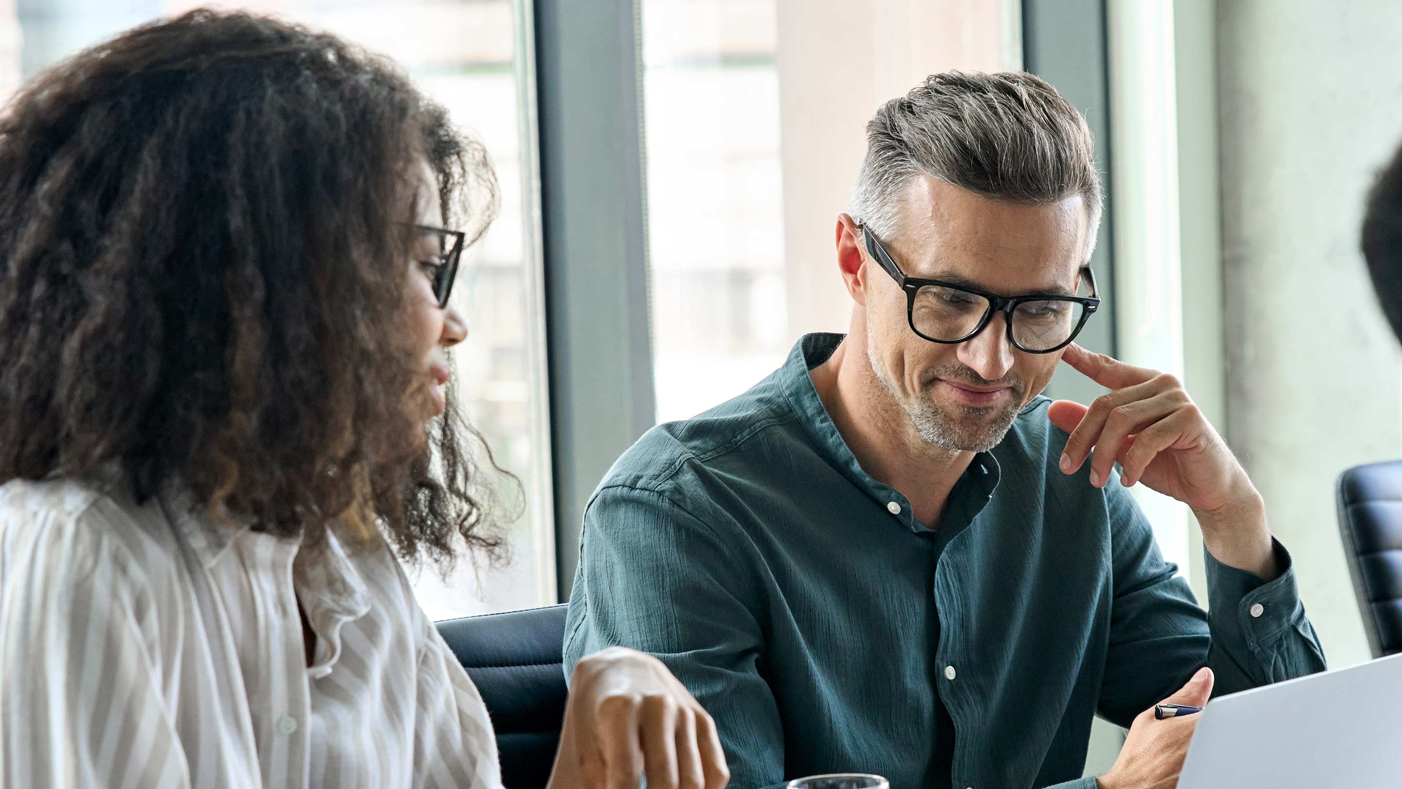 man and woman in office setting