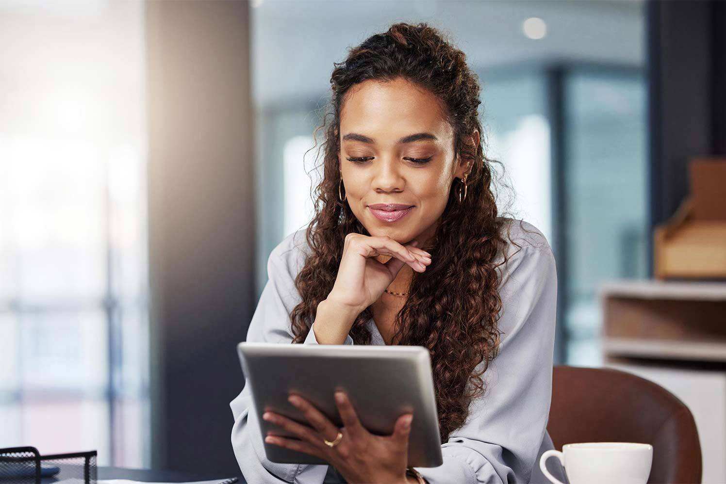 woman looking at tablet