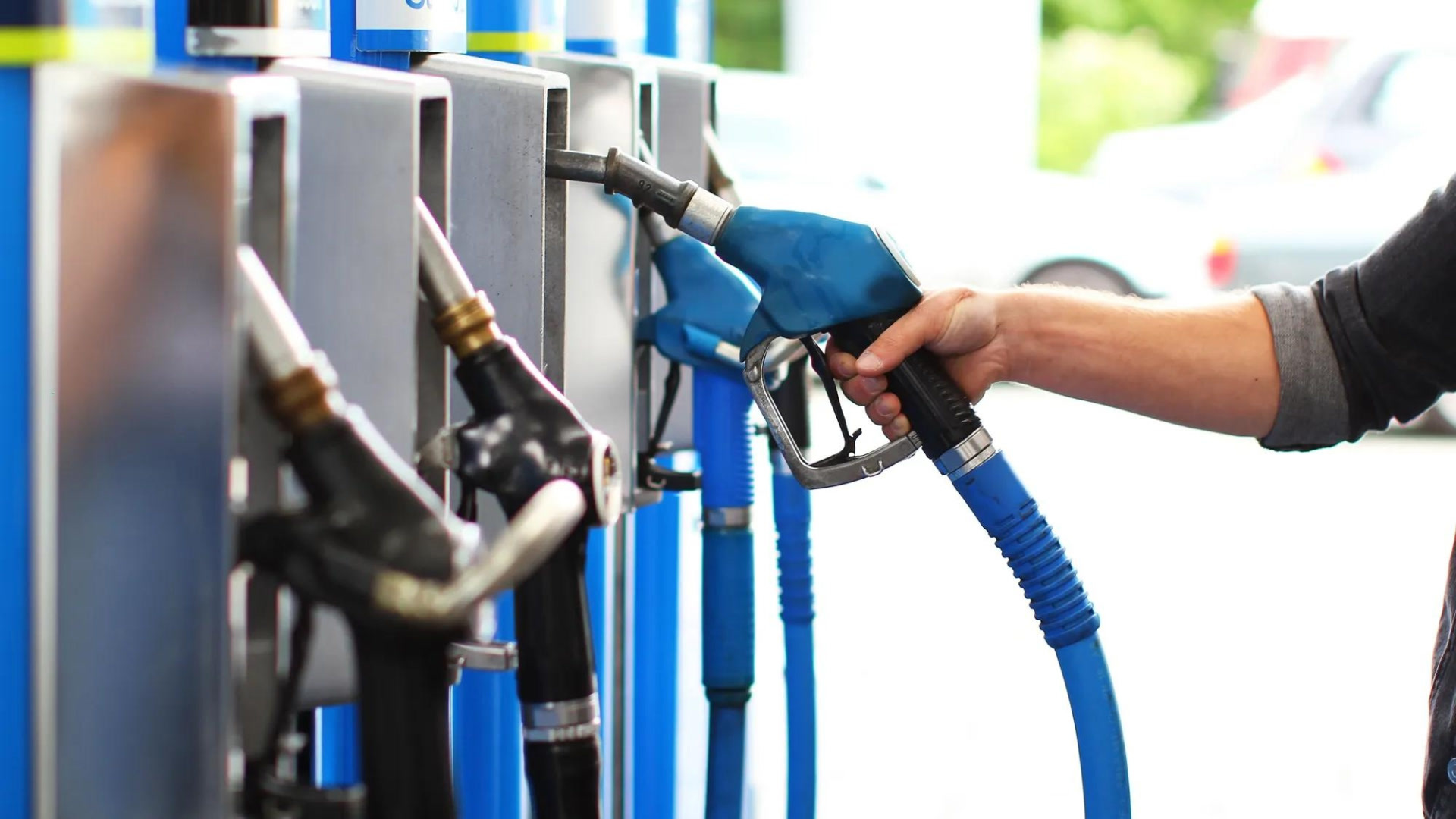 person using gas pump