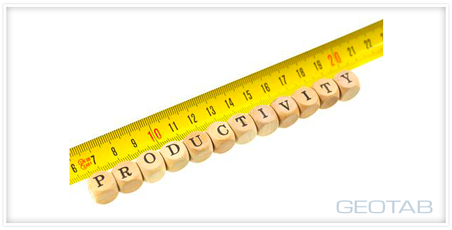 Yellow measuring tape with wood blocks next to it spelling out "Productivity"
