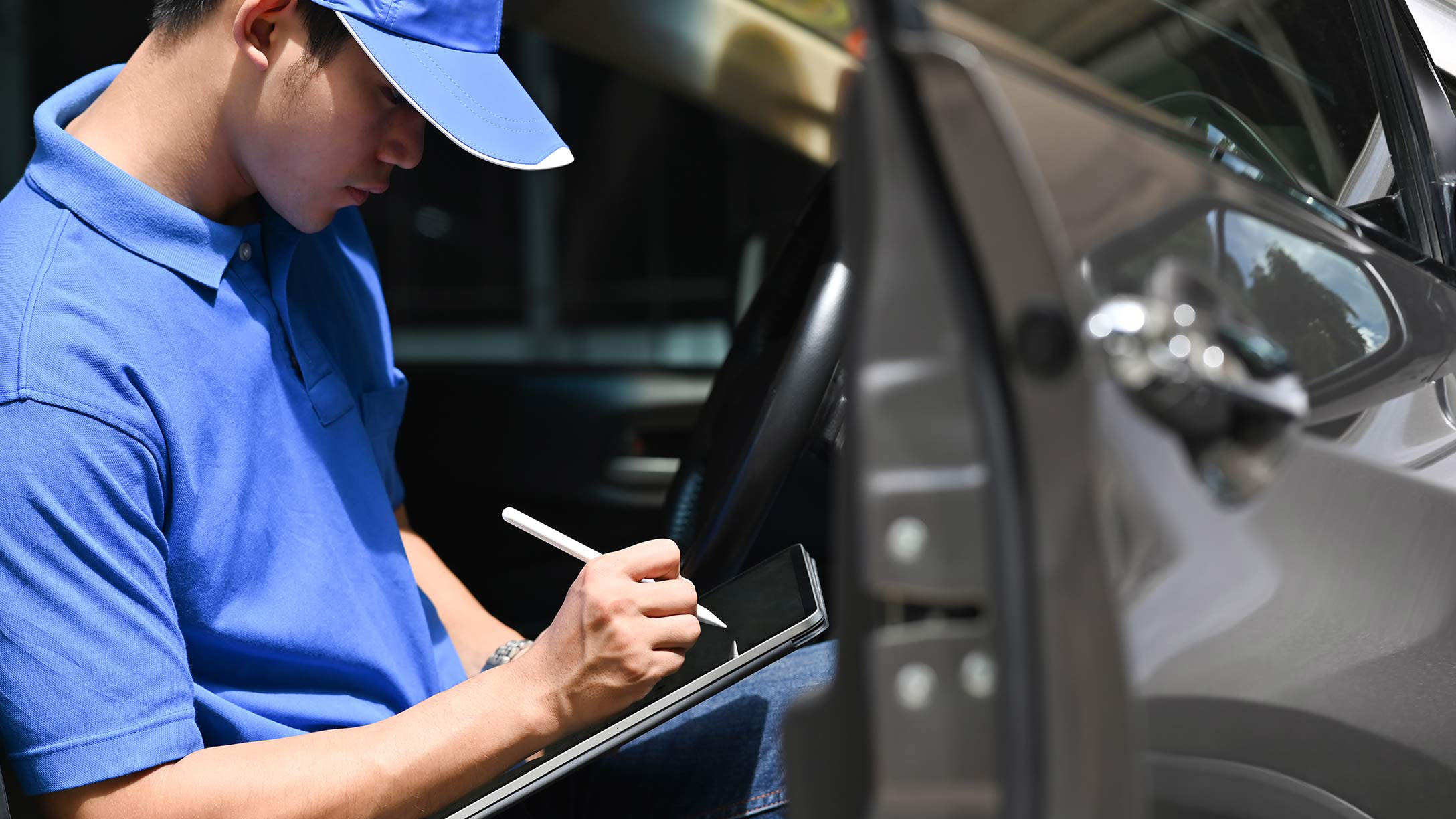 Male truck driver using a tablet
