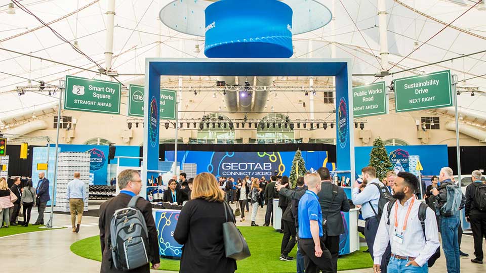 People standing at a Geotab Connect event