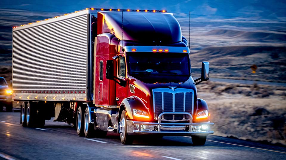 Red heavy truck on a road