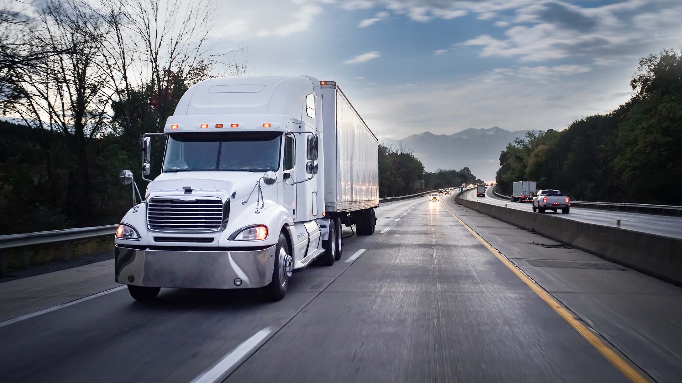 White truck driving on road