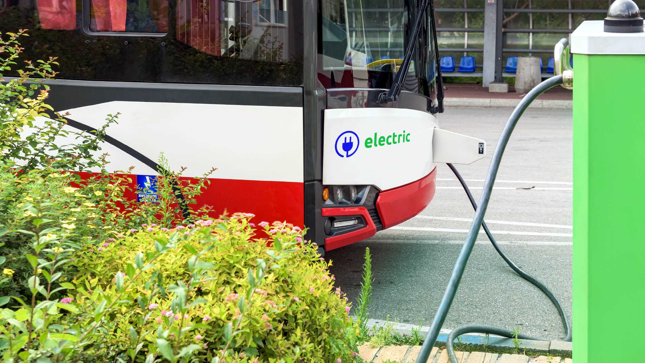 Electric bus being charged at a charging station