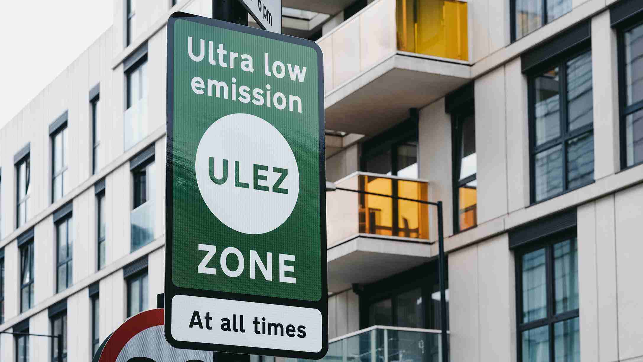 A street sign in London, England signifying that the driver is entering an ultra low emission zone and that it is enforced at all times.