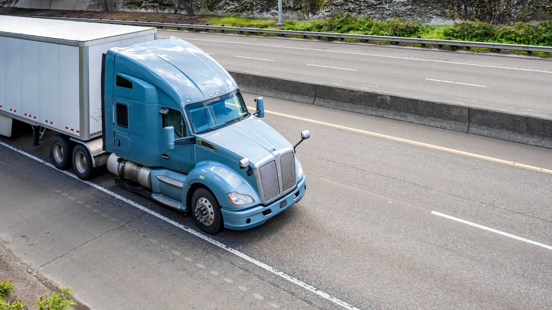 Blue truck on freeway