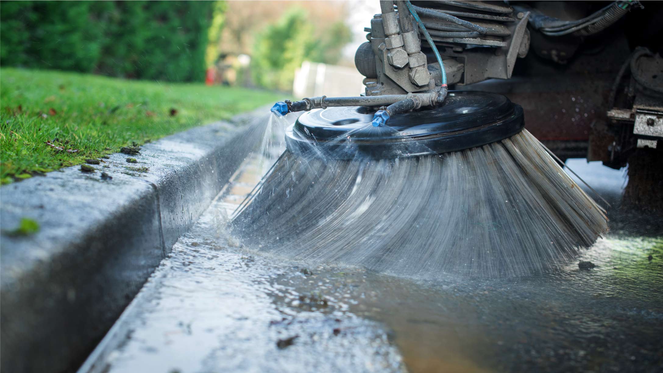 A street brush cleaning the road