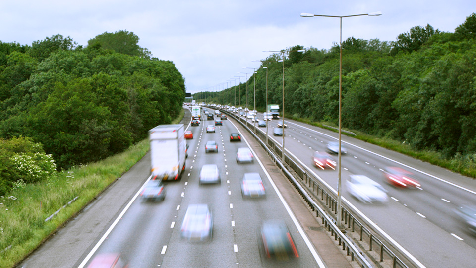 Image of vehicles driving fast on a highway