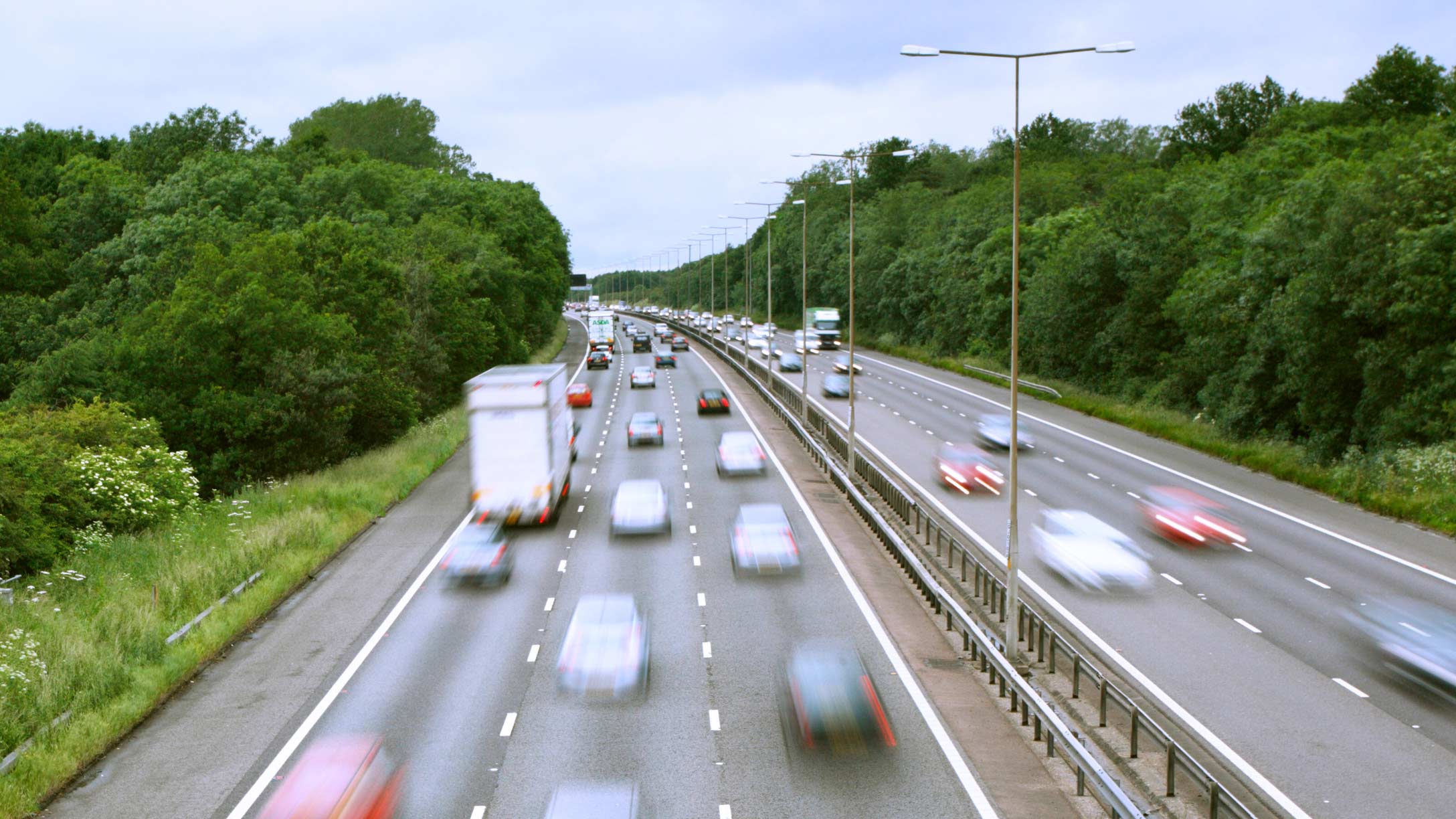 Image of vehicles driving fast on a highway