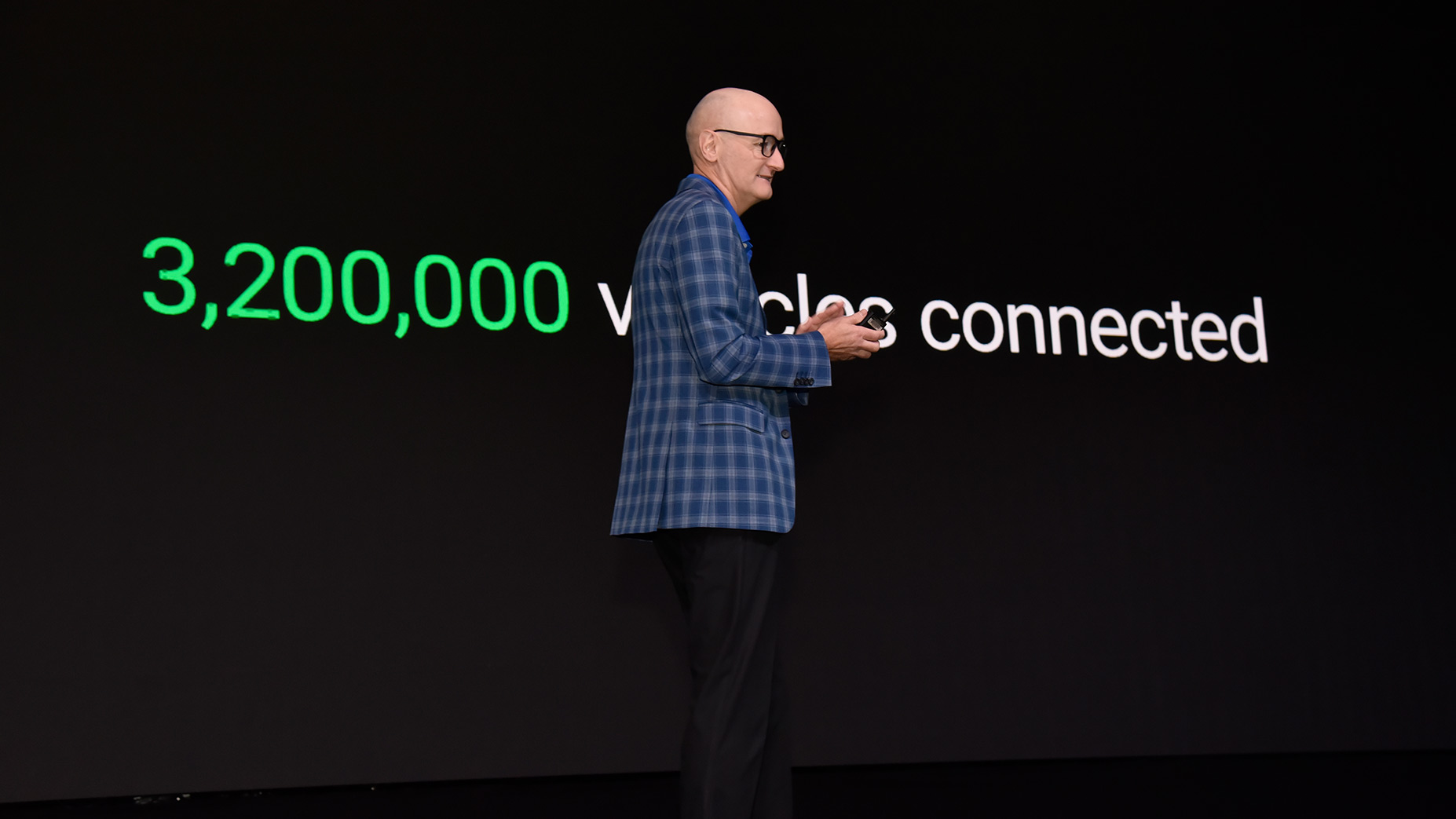 Picture of neil with metrics behind him