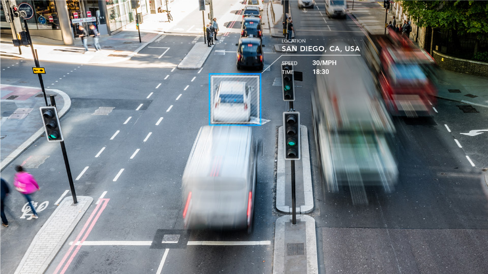 slow shutter image of busses in a city street