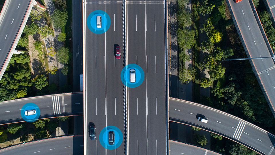 overhead view of cars driving on highway with data points
