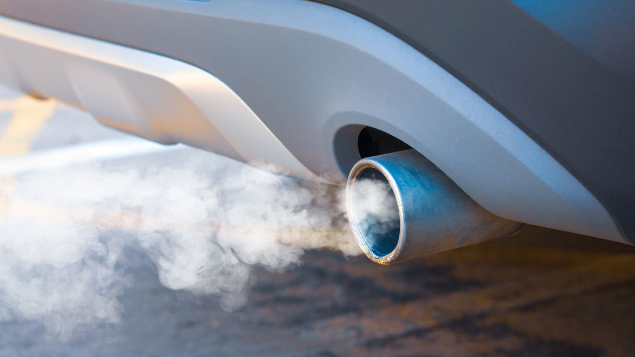 smoke coming out of an exhaust of a vehicle