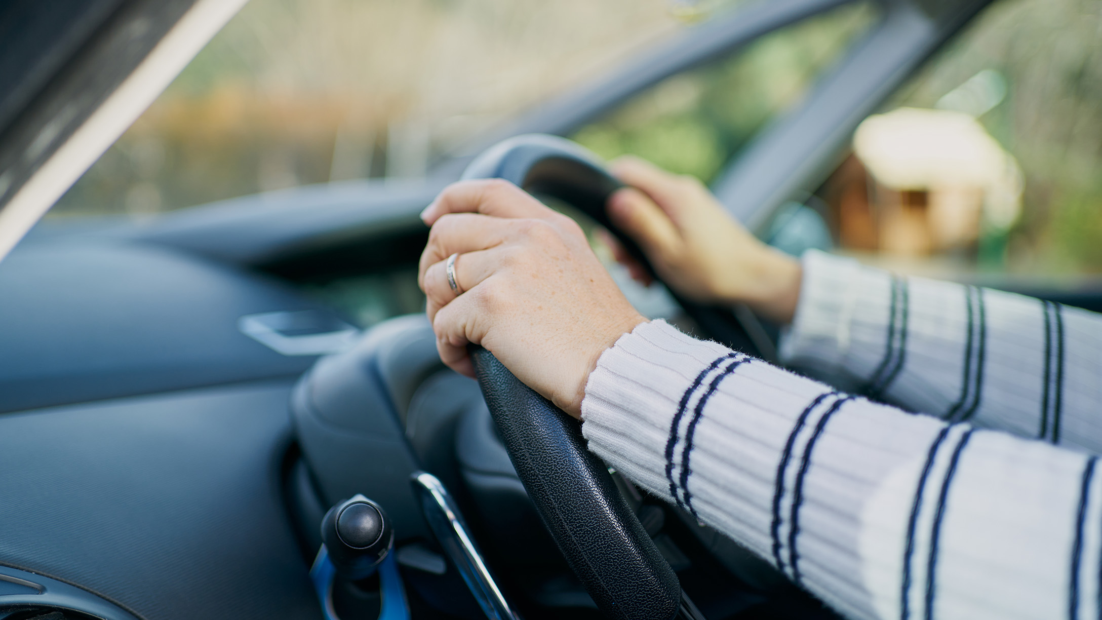 Hands on a steering wheel