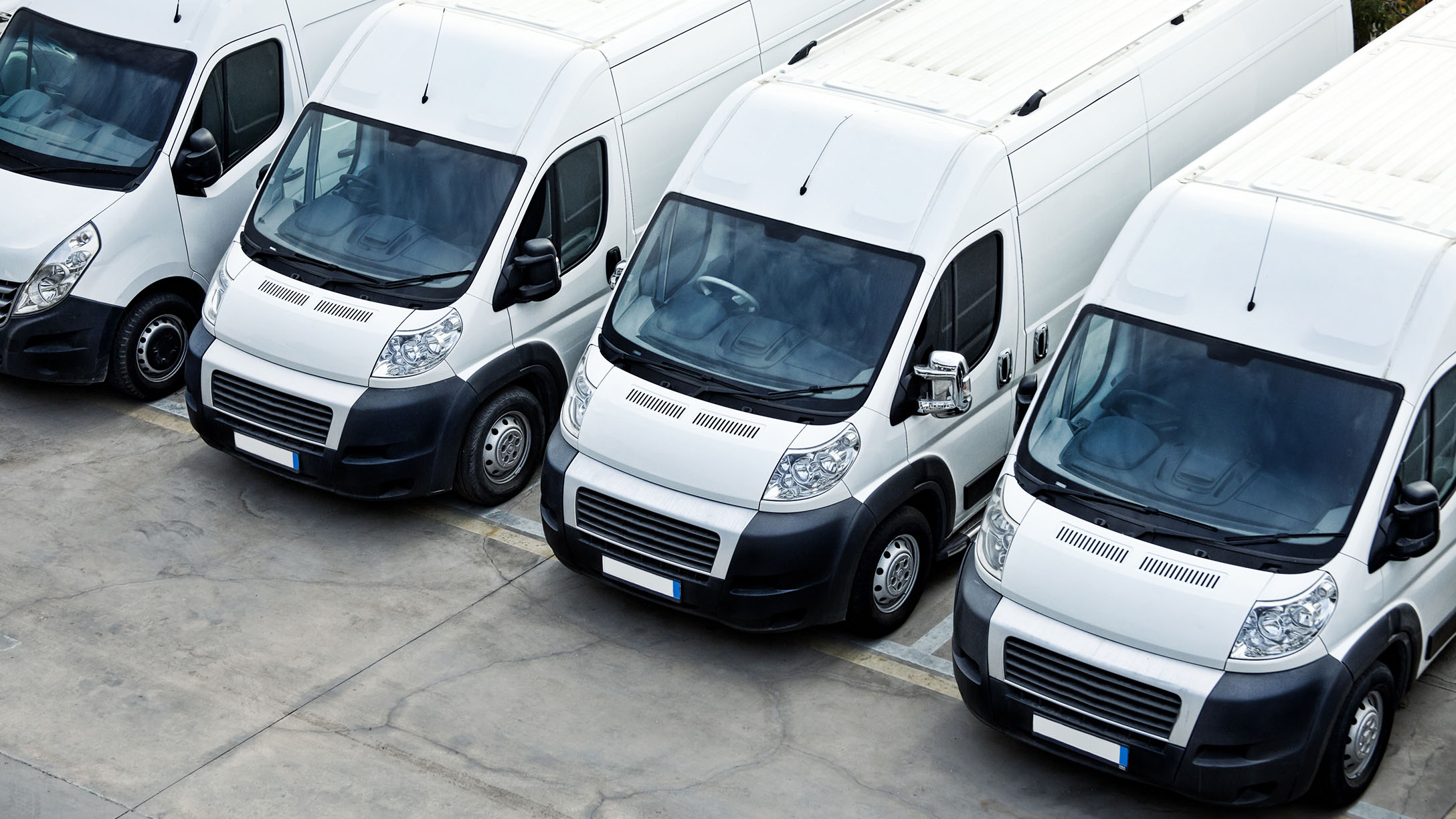 Fleet of vans parked in a row