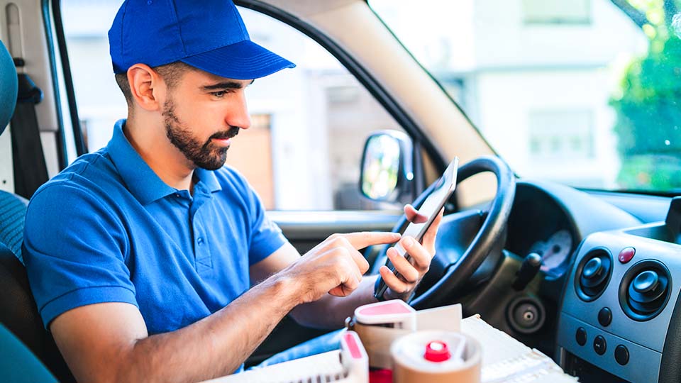 Driver sitting in the drivers seat of a van