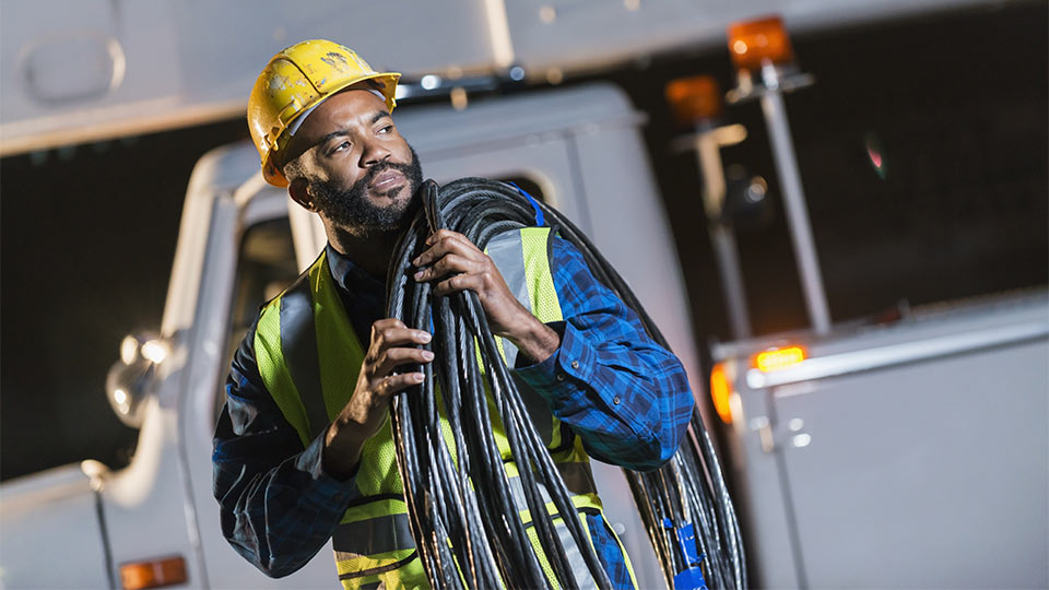 Construction worker looking over at something