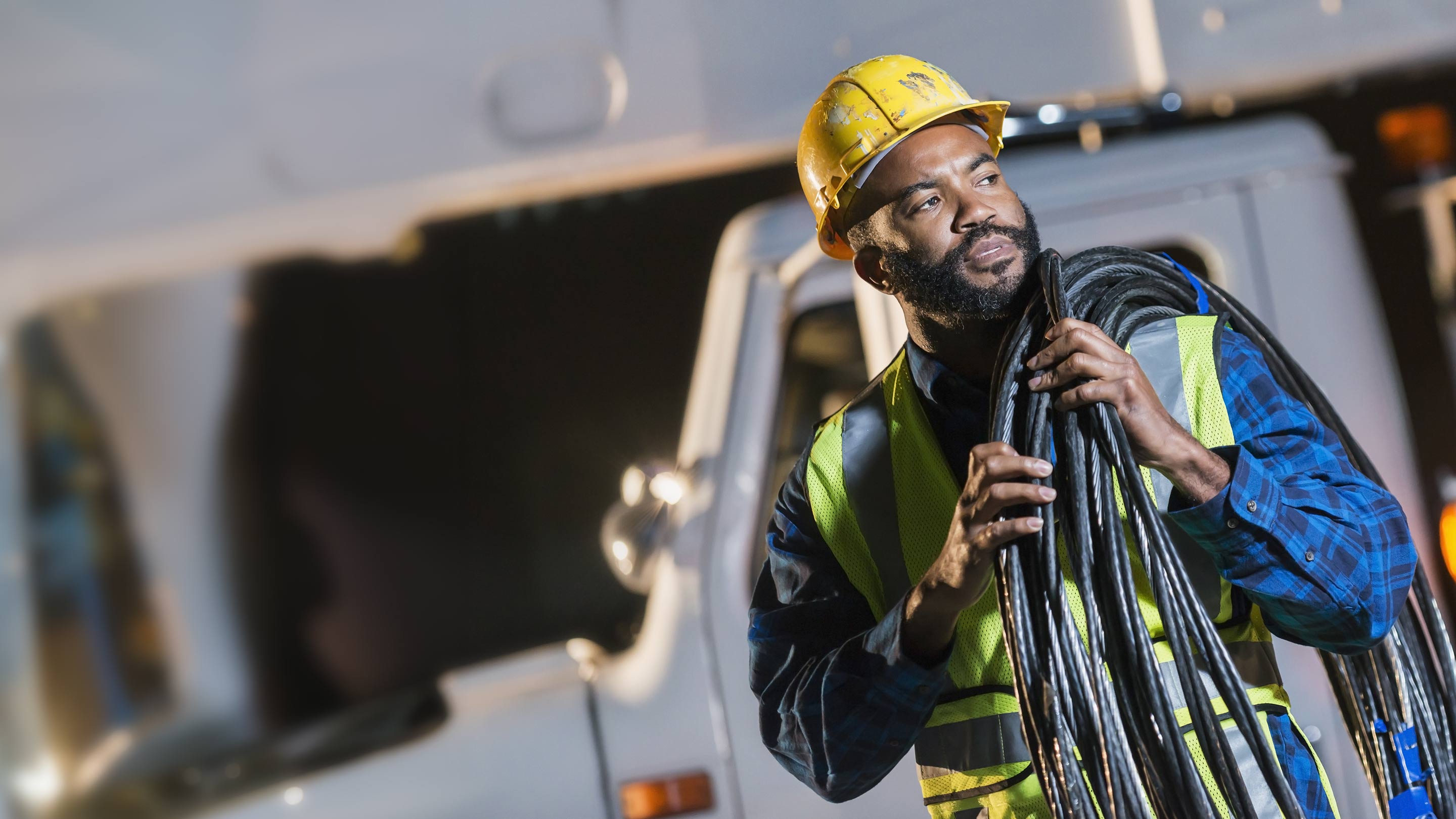 Construction worker looking over at something