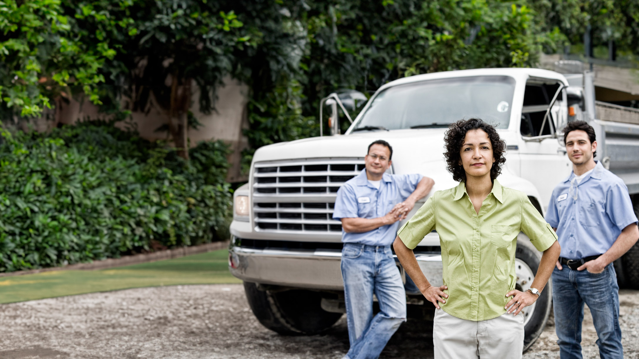 truck behind people standing together