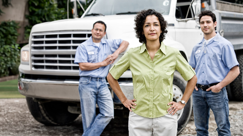 truck behind people standing together